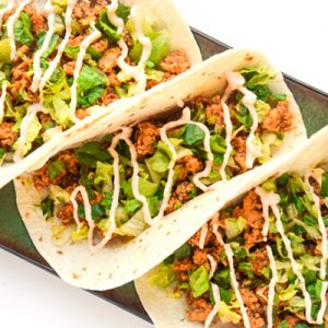 Chipotle Lime Chicken Tacos - just a few ingredients needed for these chicken tacos with chipotle lime sauce. Fresh, simple, and delicious! | tastythin.com