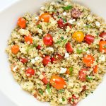Tomato Herb Quinoa Salad - A trio of sweet cherry tomatoes, fresh herbs, and creamy goat cheese brighten this tasty salad! | tastythin.com