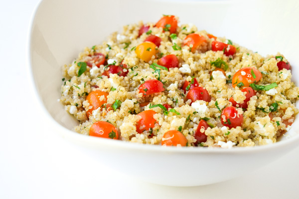 Tomato Herb Quinoa Salad - A trio of sweet cherry tomatoes, fresh herbs, and creamy goat cheese brighten this tasty salad! | tastythin.com 