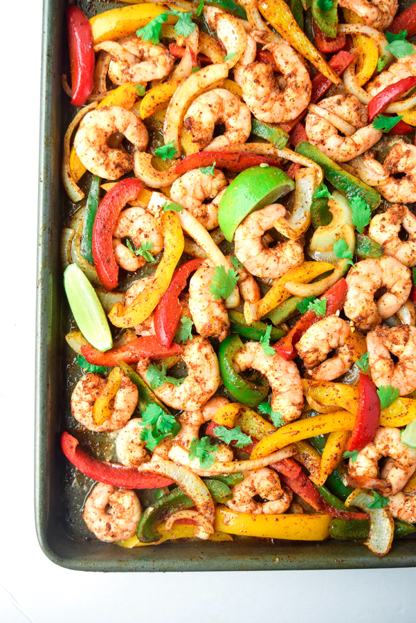 Sheet Pan Shrimp Fajitas (Paleo Whole30) - a delicious and easy dinner ready in under 15 minutes. Tasty, healthy, and family-friendly! | tastythin.com