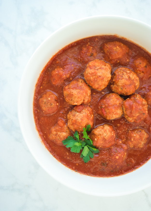 top down shot of instant pot meatballs and marinara in a large bowl