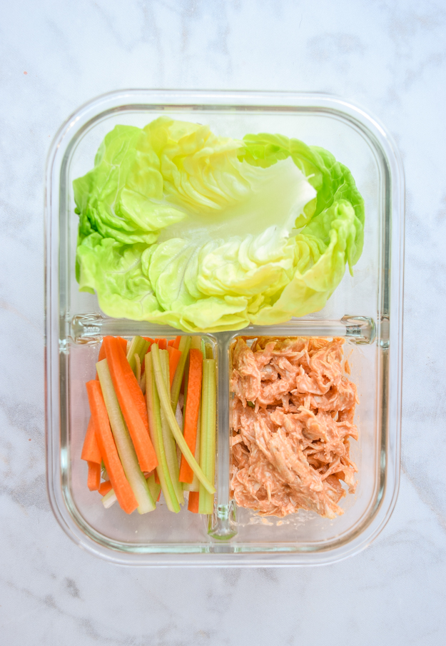 meal prep buffalo chicken wraps in 3 section container