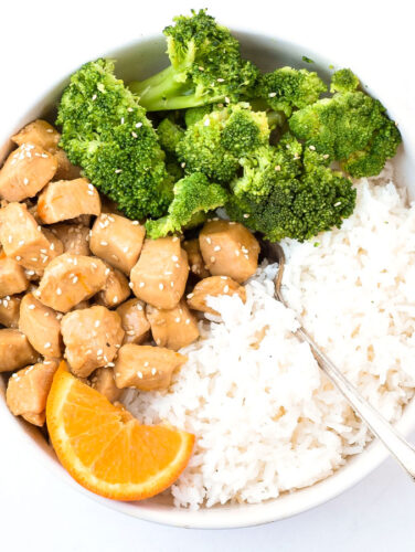 bowl of orange chicken, rice, and broccoli