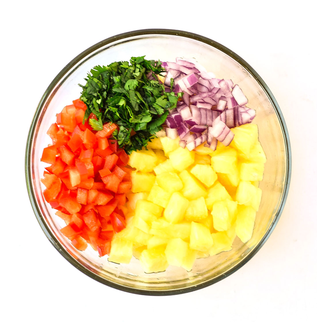 pineapple salsa ingredients in a bowl