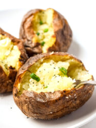 close up of baked potato with crispy skin