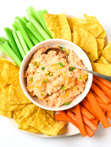 healthy buffalo chicken dip with veggies and tortilla chips