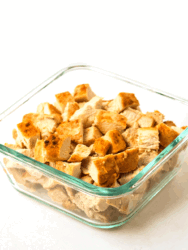 cubed air fryer chicken breast in glass container