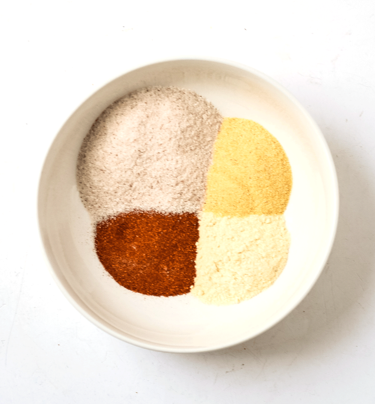 bowl with sea salt, onion powder, garlic powder, and paprika