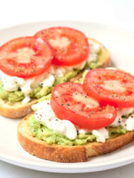 slices of sourdough bread topped with avocado, cottage cheese, and tomato