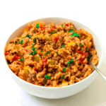 close up shot of stuffed bell pepper casserole in a bowl with fork