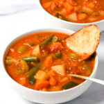 bow of instant pot vegetable stew with crusty bread