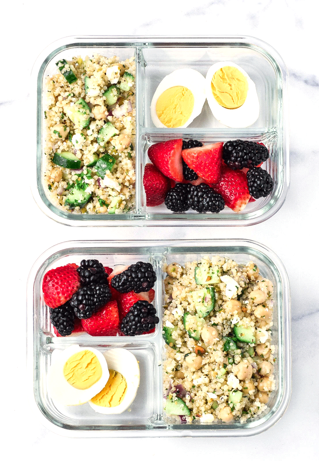 divided meal prep containers with jennifer aniston salad, hard boiled eggs, and berries