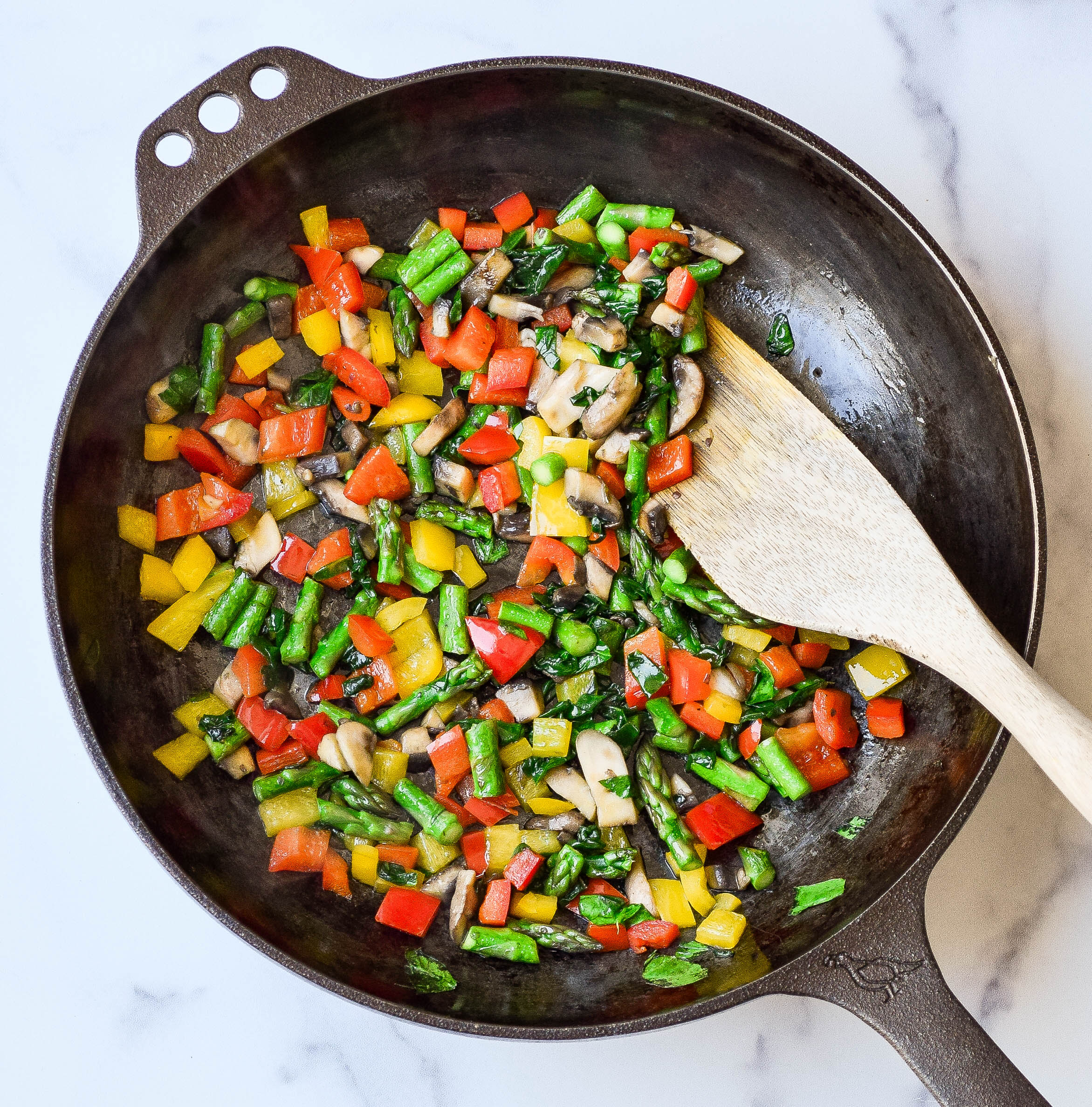 sauteed veggies for frittata in cast iron skillet
