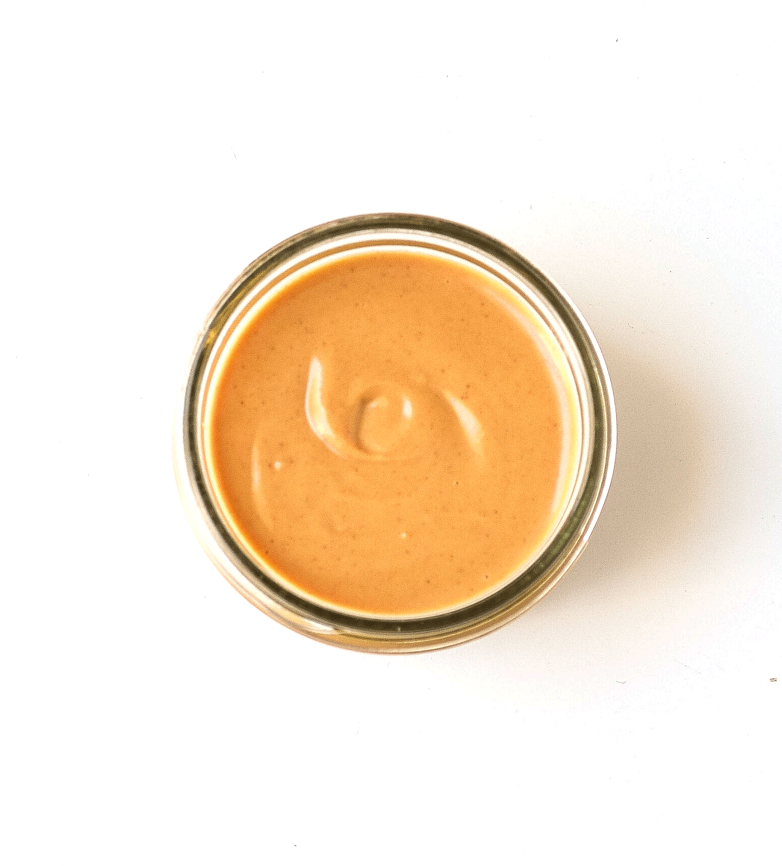 thai peanut dressing in a small mason jar